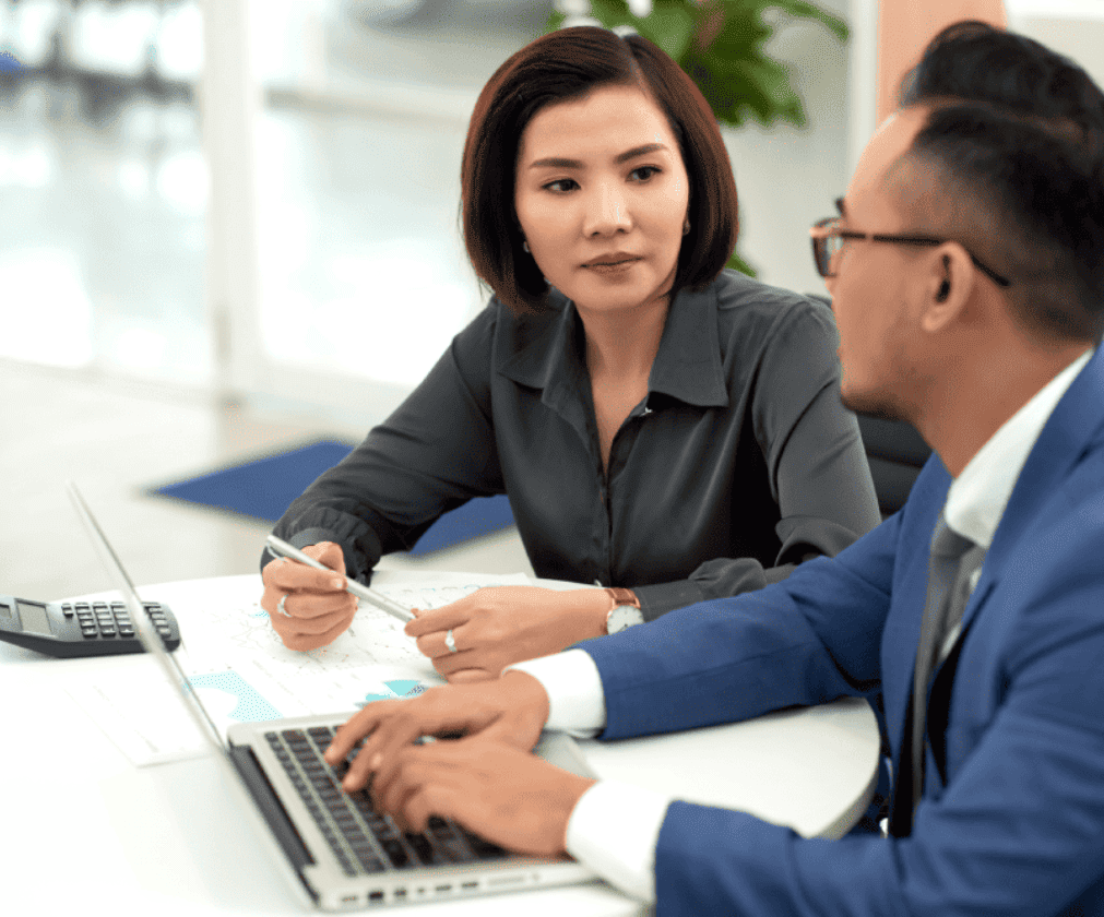 asian-man-woman-business-attire-sitting-table-indoors-talking (1) (1) (1)